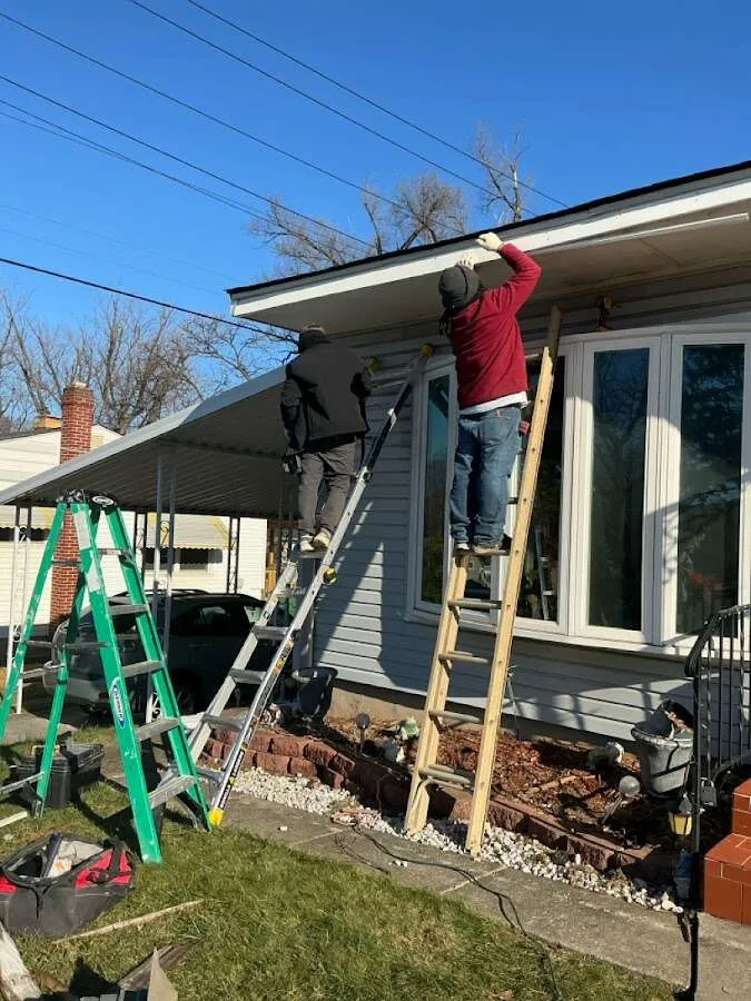Restoration crew performing exterior repair in New Castle